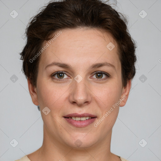 Joyful white adult female with short  brown hair and grey eyes