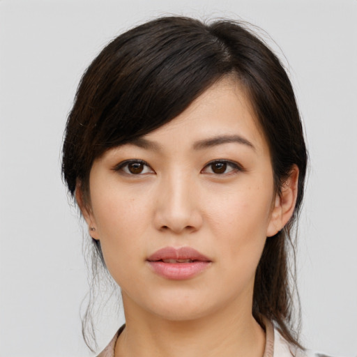 Neutral asian young-adult female with medium  brown hair and brown eyes