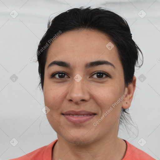 Joyful white young-adult female with medium  black hair and brown eyes