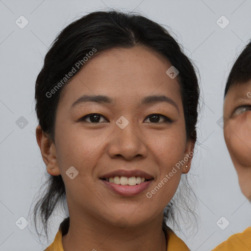 Joyful asian young-adult female with medium  brown hair and brown eyes