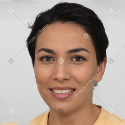 Joyful latino young-adult female with short  brown hair and brown eyes