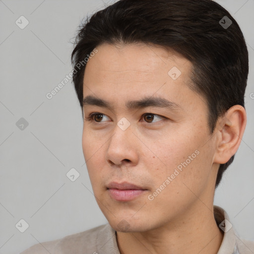 Neutral white young-adult male with short  black hair and brown eyes