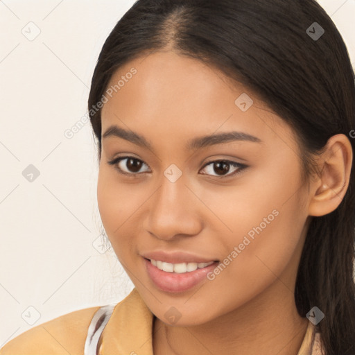 Joyful latino young-adult female with long  brown hair and brown eyes