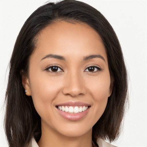 Joyful white young-adult female with long  brown hair and brown eyes