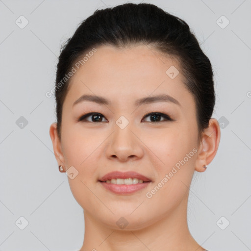 Joyful asian young-adult female with short  brown hair and brown eyes