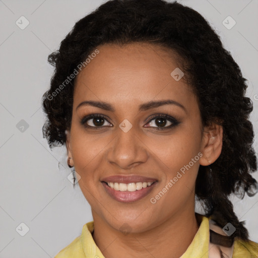 Joyful black young-adult female with medium  brown hair and brown eyes