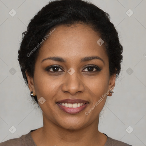 Joyful black young-adult female with short  brown hair and brown eyes