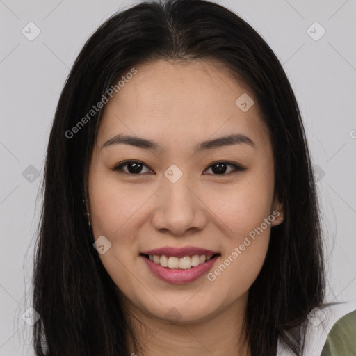 Joyful asian young-adult female with long  brown hair and brown eyes