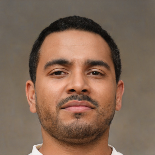 Neutral latino young-adult male with short  brown hair and brown eyes