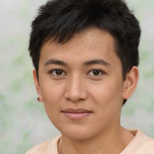 Joyful asian young-adult male with short  brown hair and brown eyes