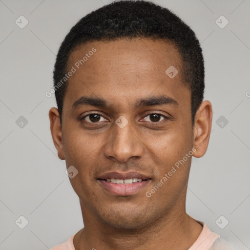 Joyful black young-adult male with short  black hair and brown eyes