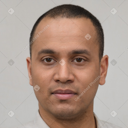 Neutral latino young-adult male with short  black hair and brown eyes