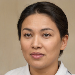 Joyful white adult female with medium  brown hair and brown eyes