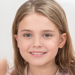 Joyful white child female with long  brown hair and brown eyes