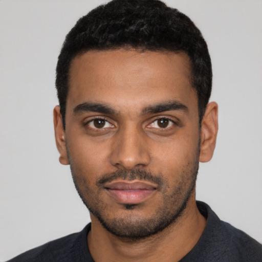Neutral black young-adult male with short  black hair and brown eyes