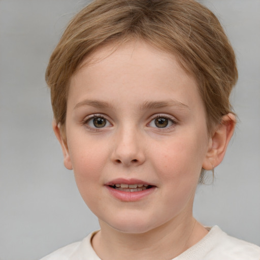 Joyful white child female with short  brown hair and grey eyes