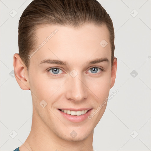 Joyful white young-adult male with short  brown hair and grey eyes