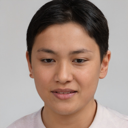 Joyful asian young-adult female with short  brown hair and brown eyes