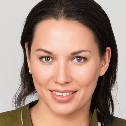 Joyful white young-adult female with medium  brown hair and brown eyes