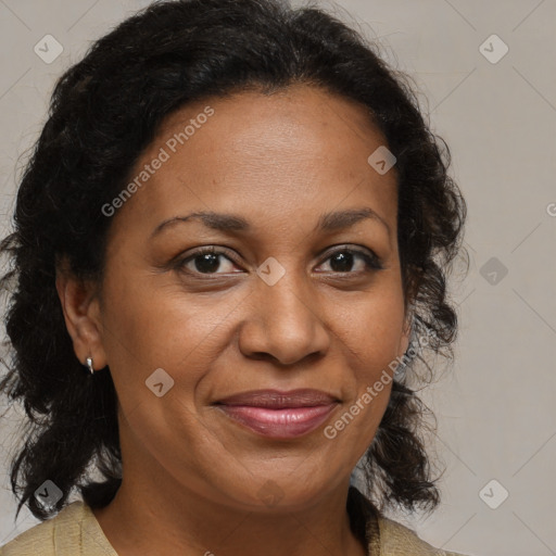 Joyful black adult female with medium  brown hair and brown eyes