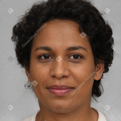 Joyful black adult female with short  brown hair and brown eyes