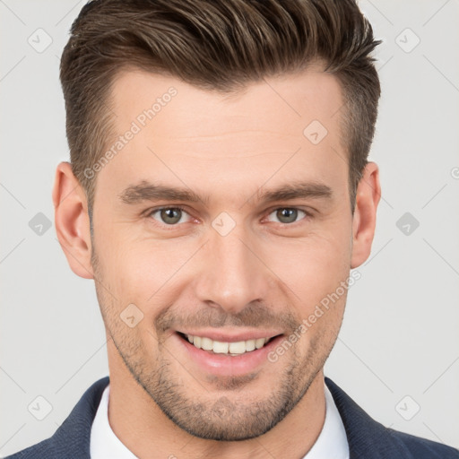 Joyful white young-adult male with short  brown hair and brown eyes