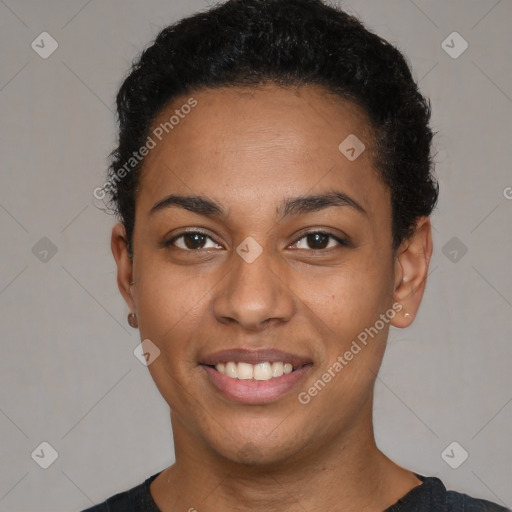 Joyful black young-adult female with short  black hair and brown eyes