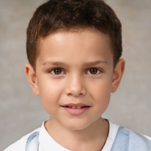 Joyful white child male with short  brown hair and brown eyes