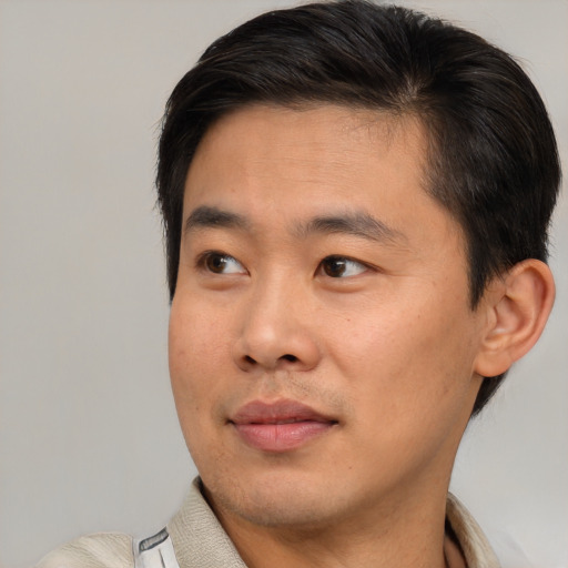 Neutral asian young-adult male with short  brown hair and brown eyes