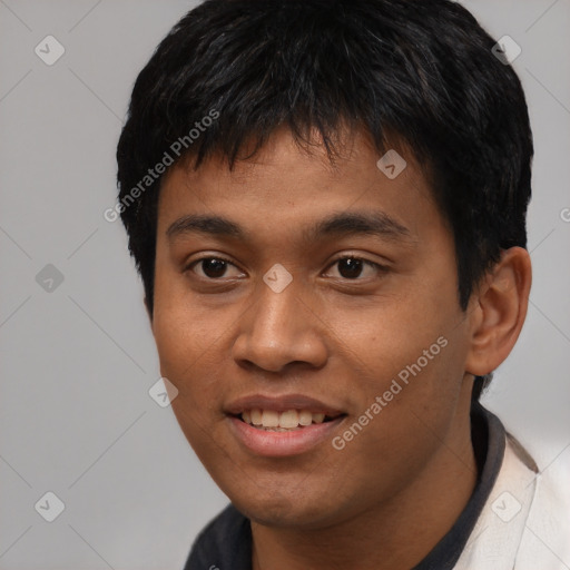 Joyful asian young-adult male with short  black hair and brown eyes