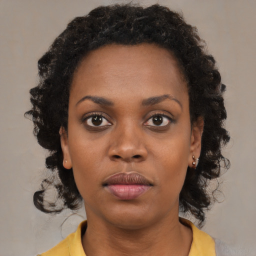 Neutral black young-adult female with medium  black hair and brown eyes