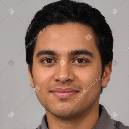 Joyful latino young-adult male with short  black hair and brown eyes