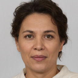 Joyful white adult female with short  brown hair and brown eyes