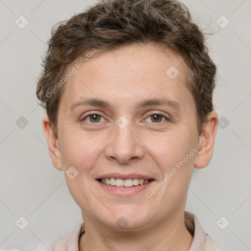 Joyful white adult female with short  brown hair and grey eyes