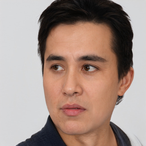 Neutral white young-adult male with short  black hair and brown eyes