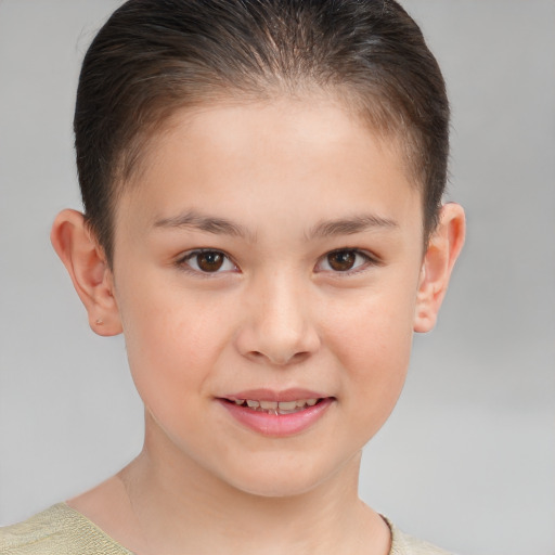 Joyful white child female with short  brown hair and brown eyes