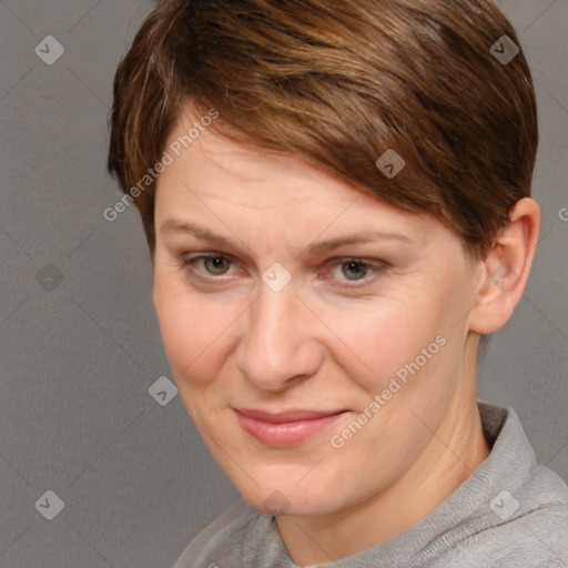 Joyful white adult female with short  brown hair and grey eyes