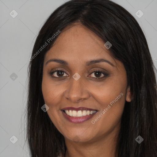 Joyful latino young-adult female with long  brown hair and brown eyes