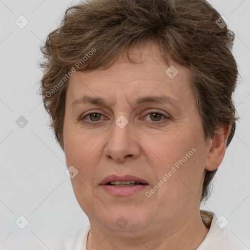 Joyful white adult female with short  brown hair and brown eyes