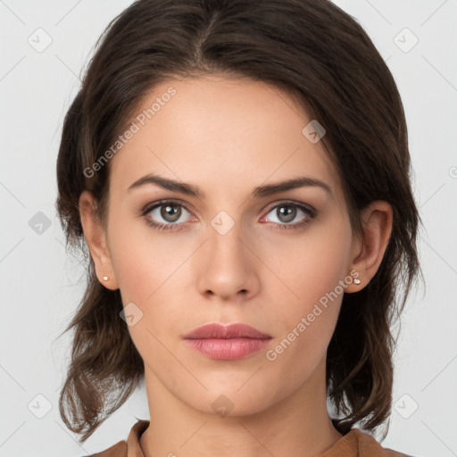 Neutral white young-adult female with medium  brown hair and brown eyes