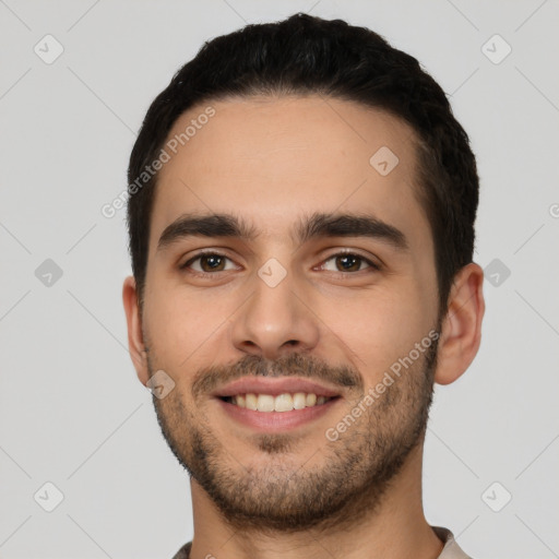 Joyful white young-adult male with short  brown hair and brown eyes