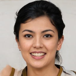 Joyful asian young-adult female with medium  black hair and brown eyes