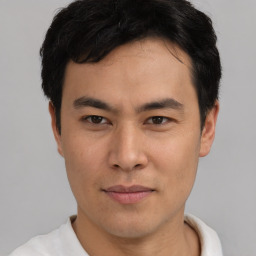 Neutral asian young-adult male with short  brown hair and brown eyes