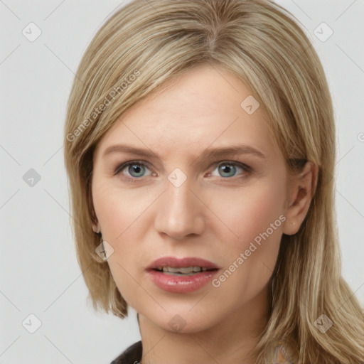 Joyful white young-adult female with medium  brown hair and blue eyes