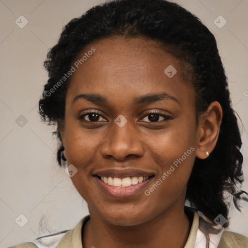 Joyful black young-adult female with medium  black hair and brown eyes