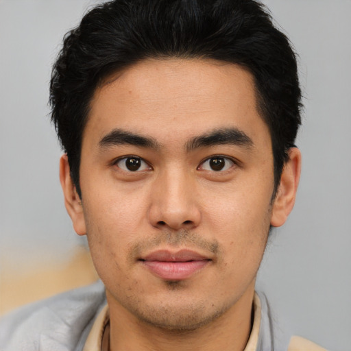 Neutral latino young-adult male with short  brown hair and brown eyes