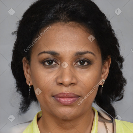 Joyful latino adult female with medium  brown hair and brown eyes