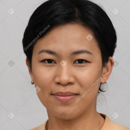 Joyful asian young-adult female with short  black hair and brown eyes