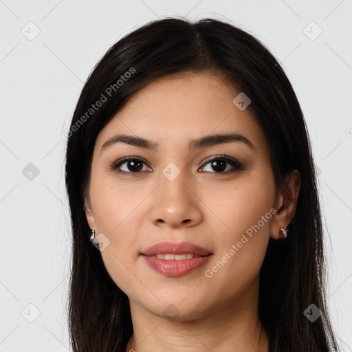 Joyful latino young-adult female with long  brown hair and brown eyes