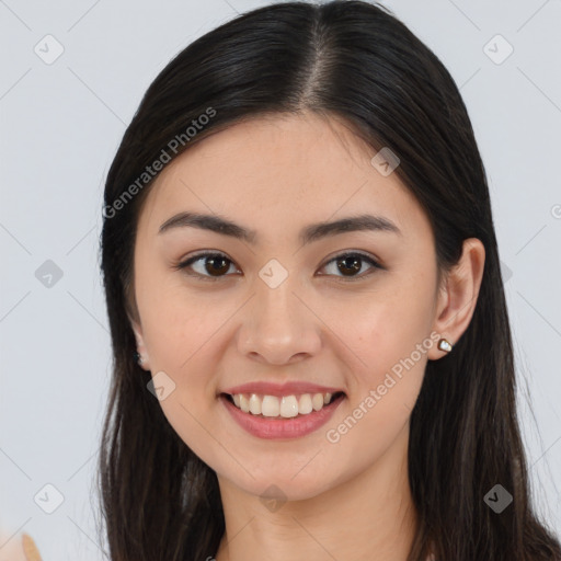 Joyful asian young-adult female with long  brown hair and brown eyes